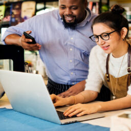 Business Owners reviewing customer engagements and reviews online.