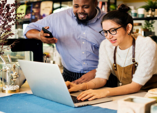 Business Owners reviewing customer engagements and reviews online.