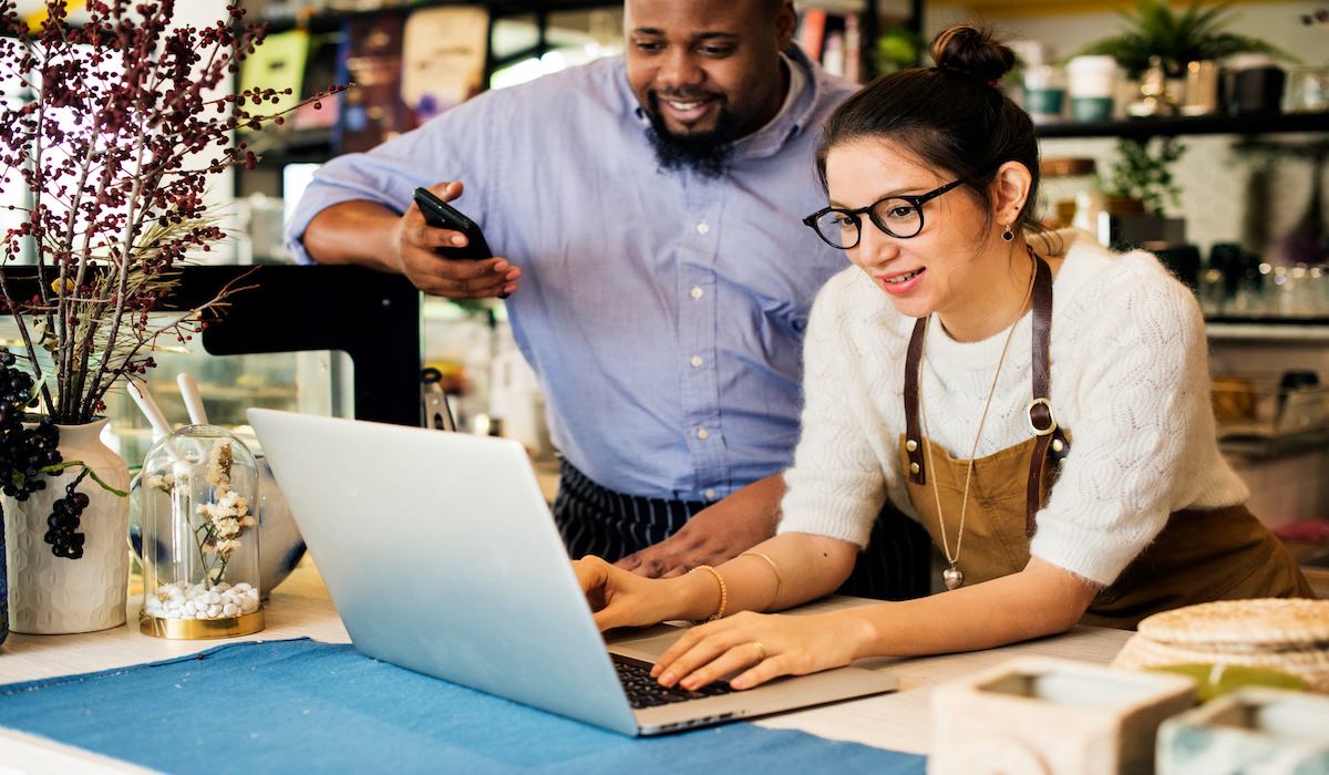 Business Owners reviewing customer engagements and reviews online.